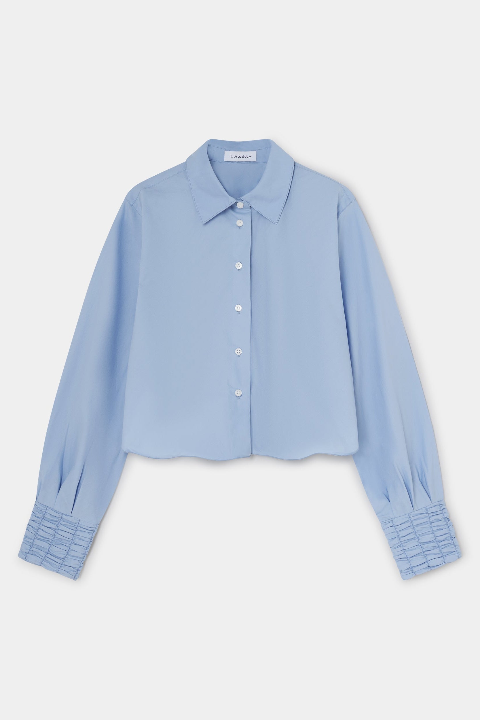 Light blue shirt on a light gray background