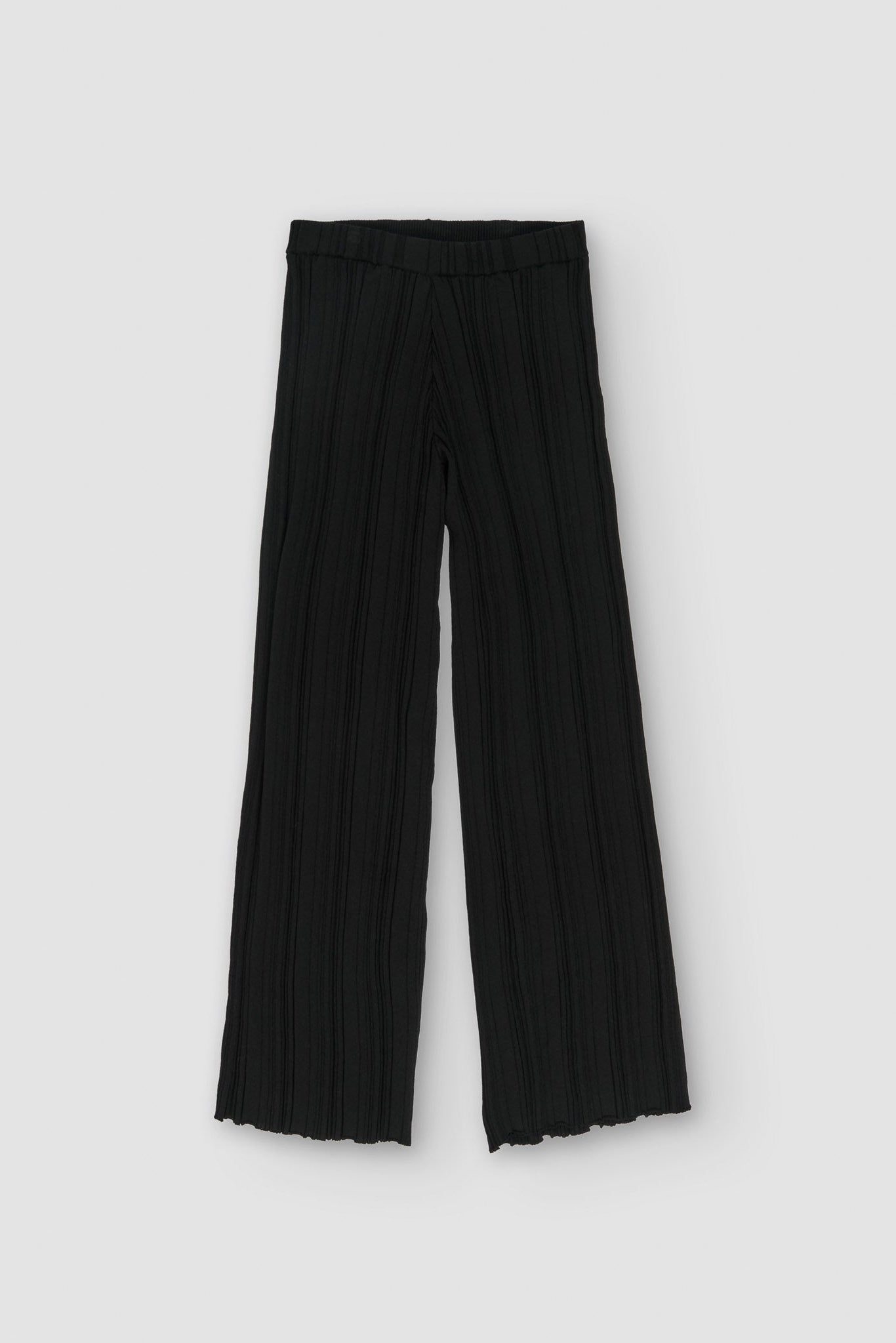 Black pleated pants on a white background