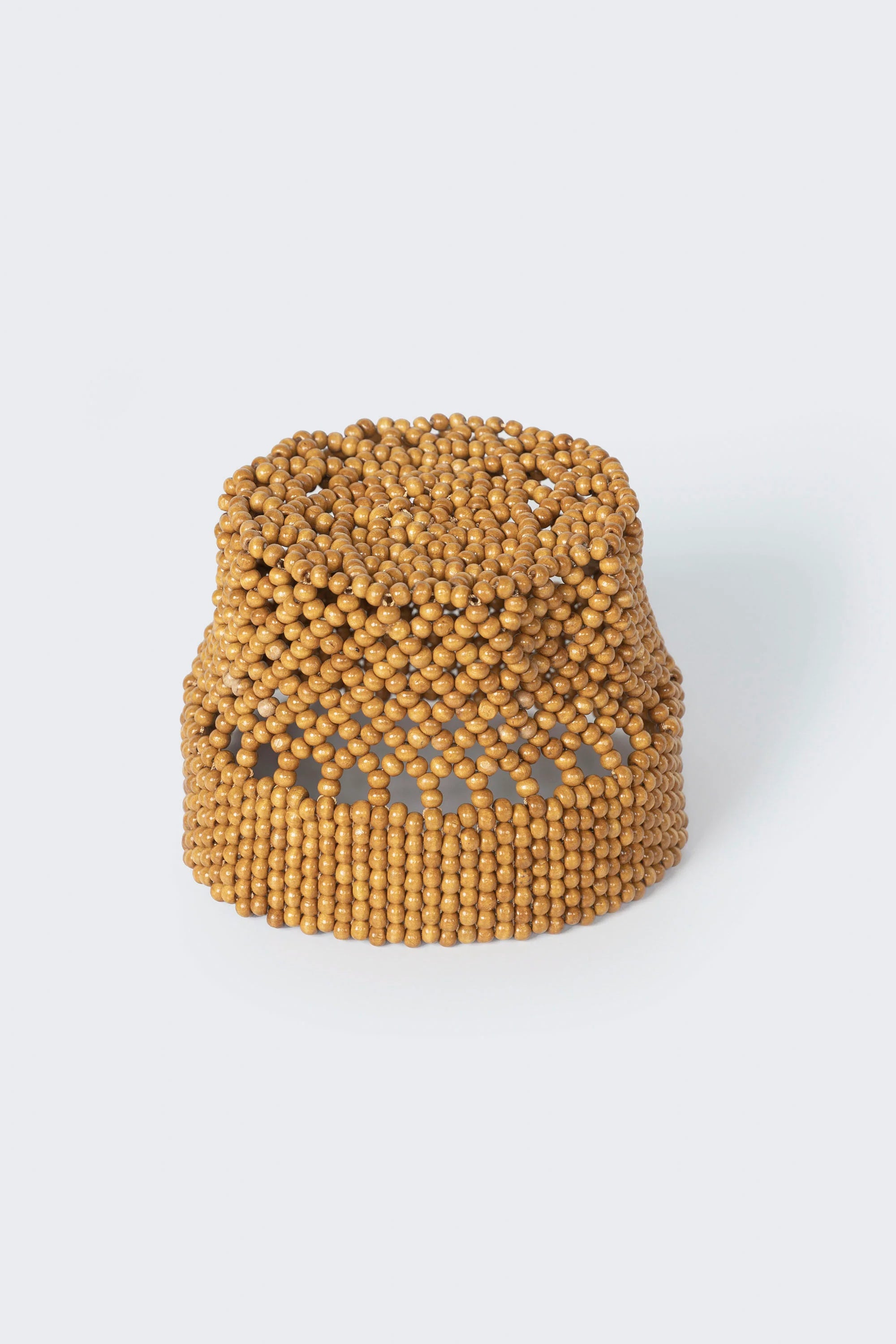 Brown beaded headband on a white background