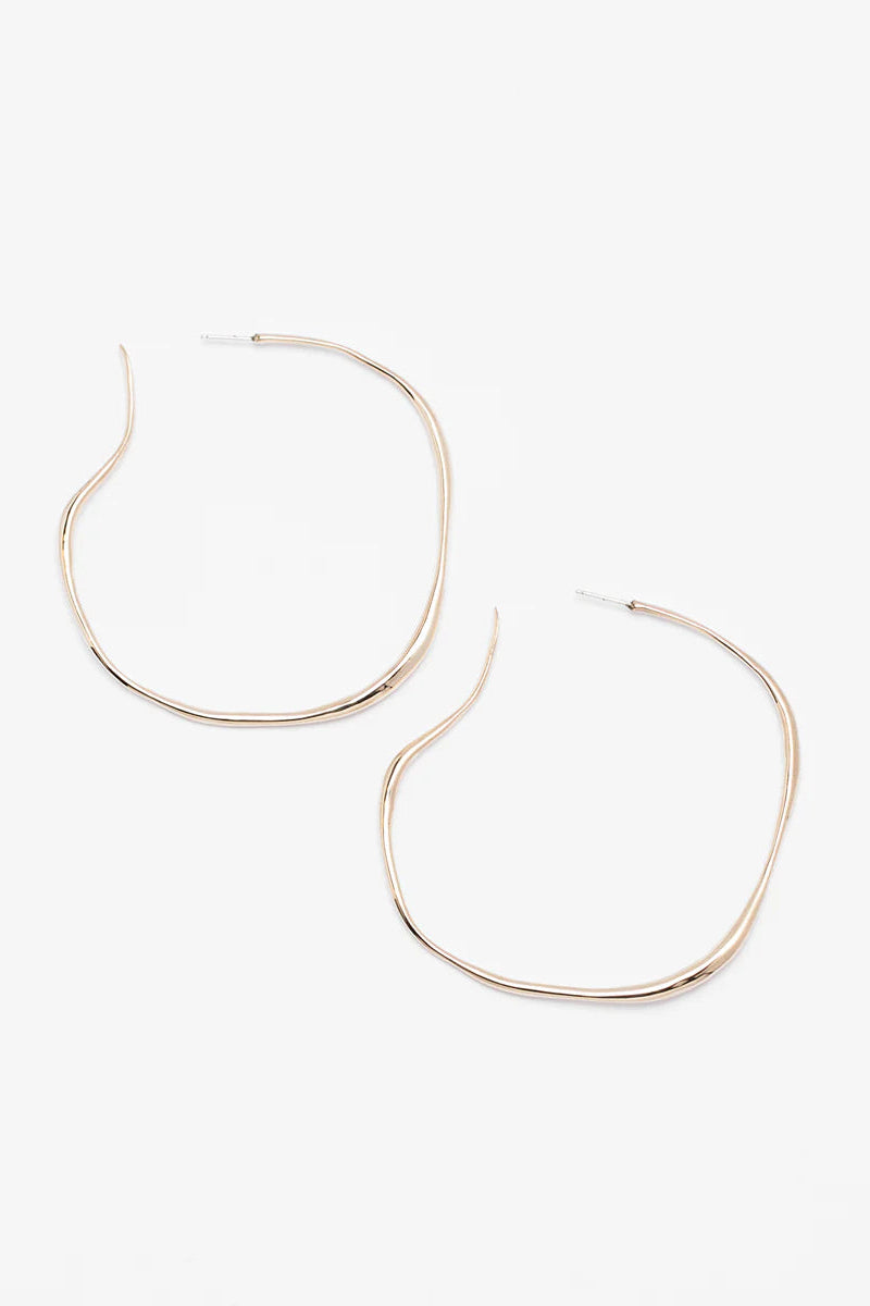 Gold hoop earrings on a white background