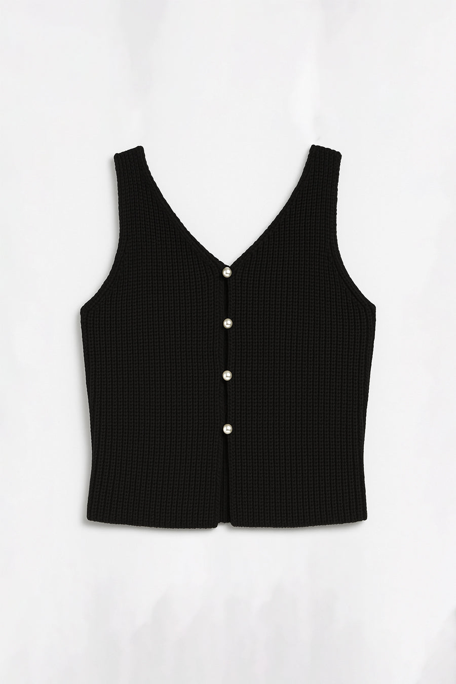 Black sleeveless top with buttons on a white background