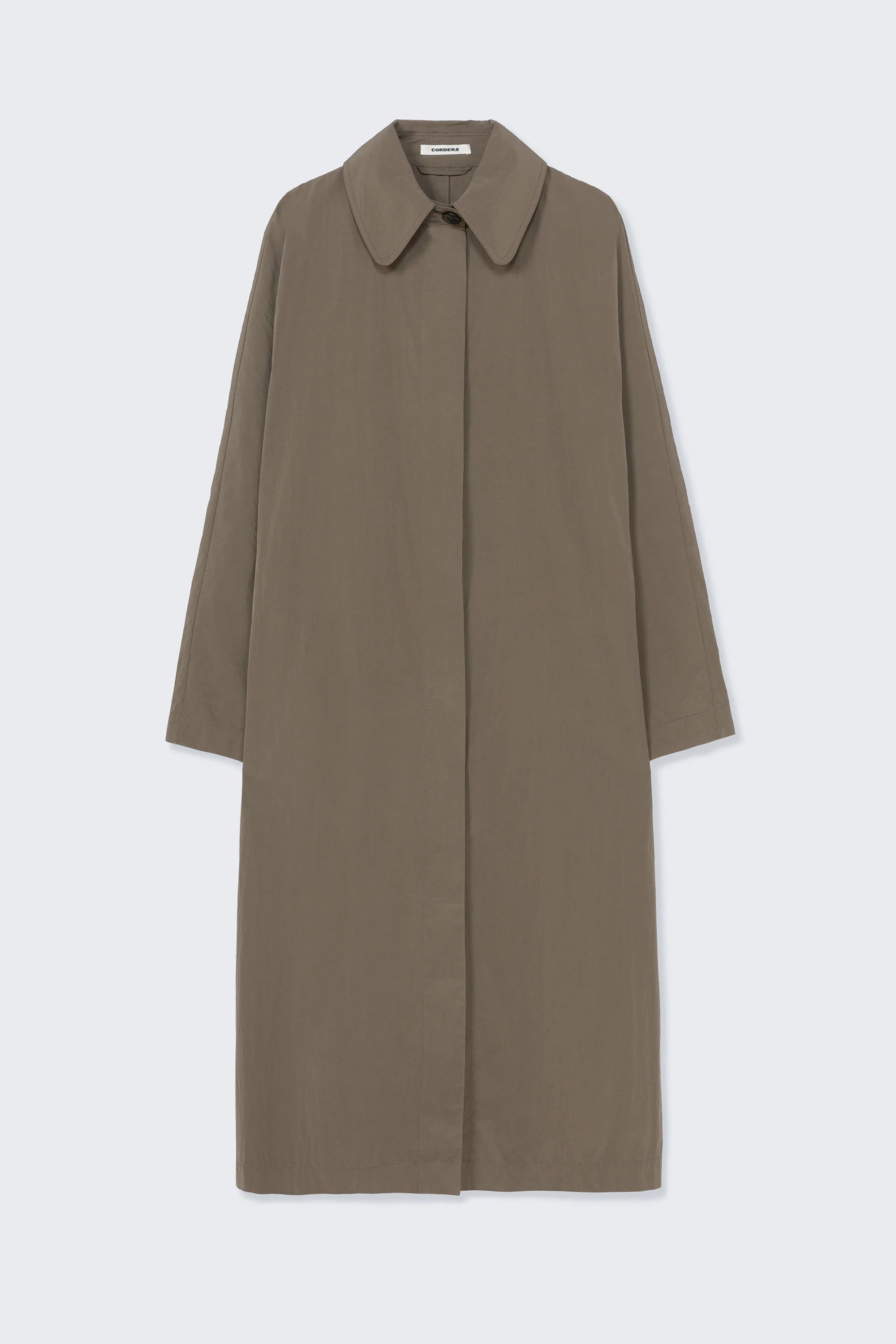 Long beige coat on a light gray background
