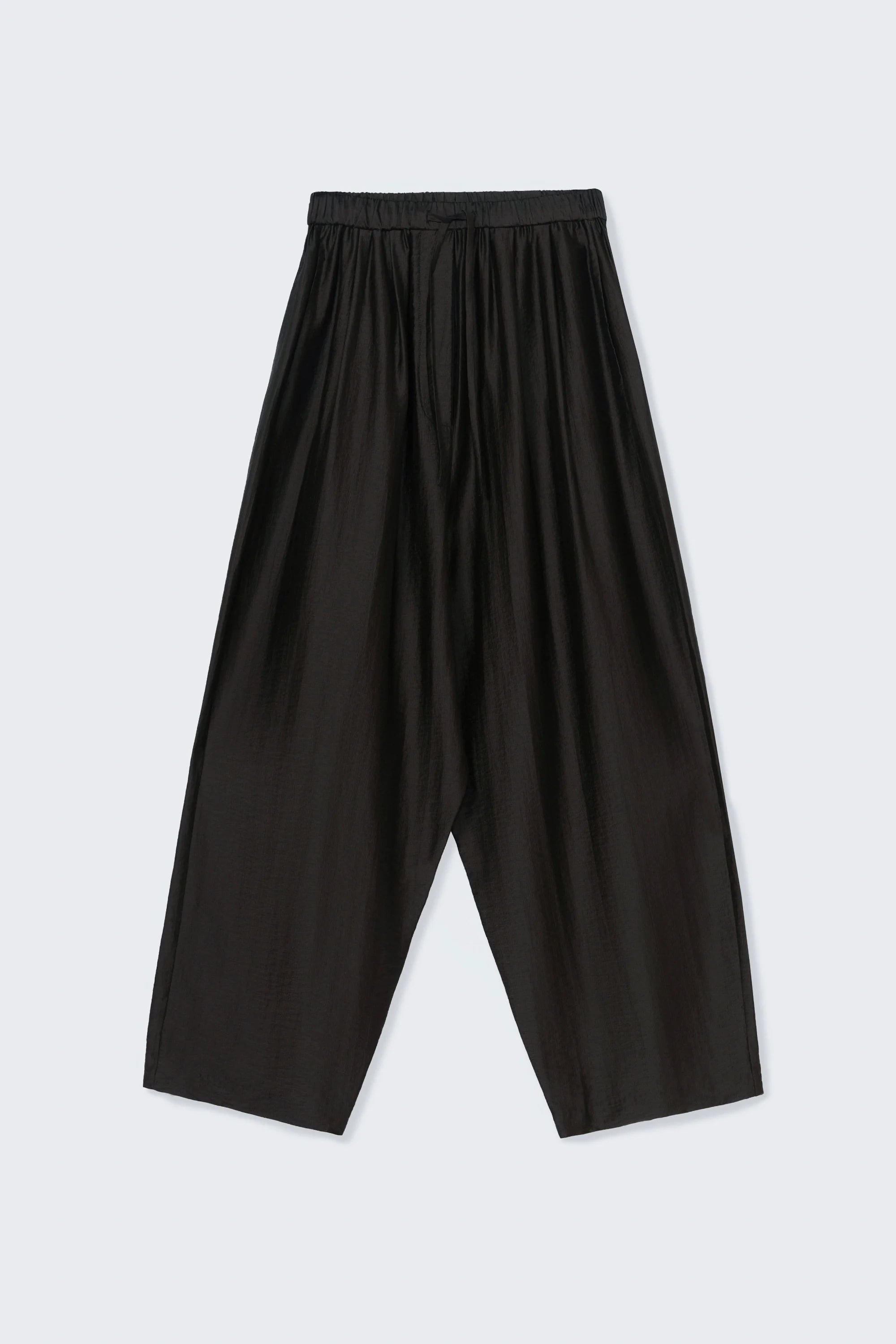 Black pants on a light gray background